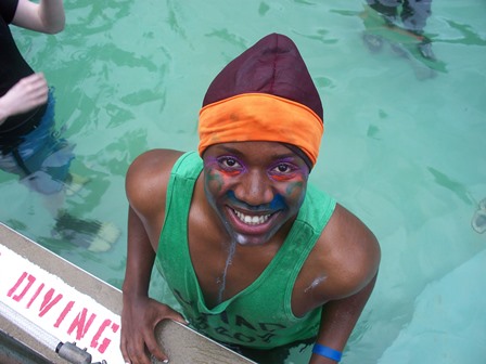 camper smiling for the camera in the pool