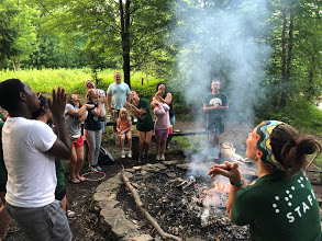 image of campers around the fire