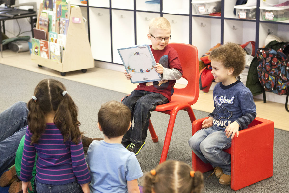 Kids reading together in class.