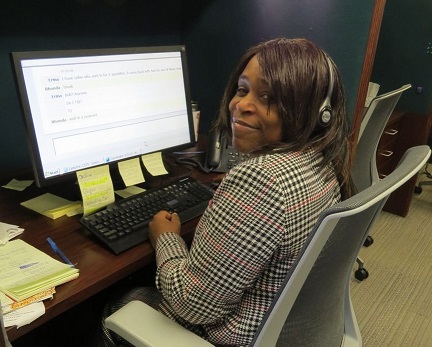 Rhonda Hills at her desk in the call center.