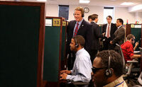 Secretary of State John Husted listening in to a call at CSC's call center.