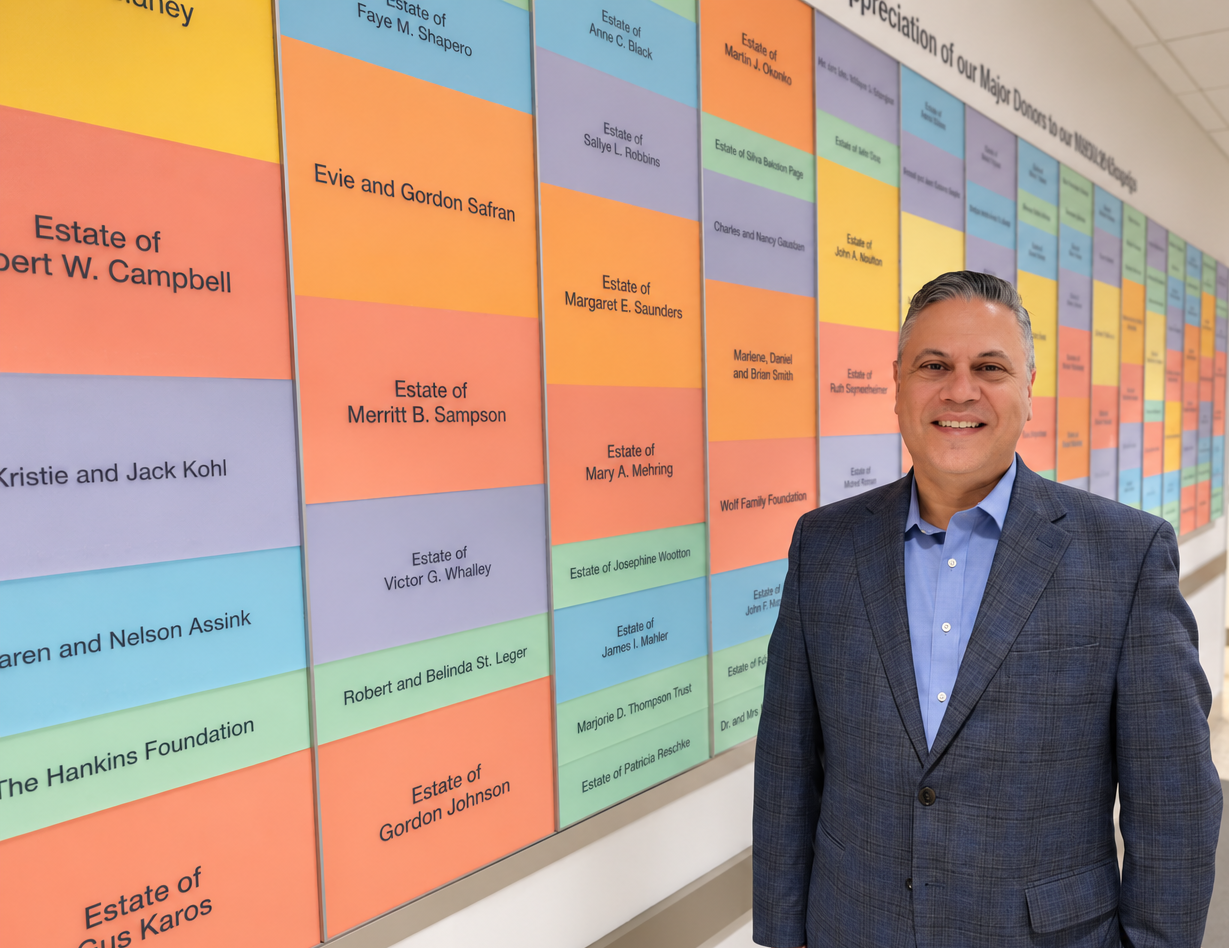 Dr. Wolynski smiles for a photo in the hallway of Cleveland Sight Center