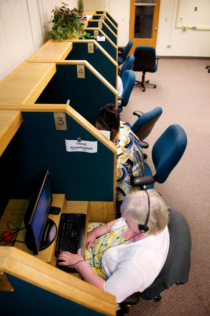 Vision impaired employees working in a call center.