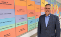 Dr. Wolynski smiles for a photo in the hallway of Cleveland Sight Center